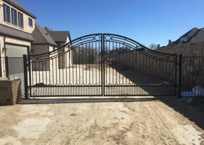 Elegant Wooden Drive Gate Installation by Spring Creek Fence and Gate