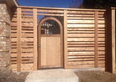 Custom Wooden Drive Gate Installation by Spring Creek Fence and Gate